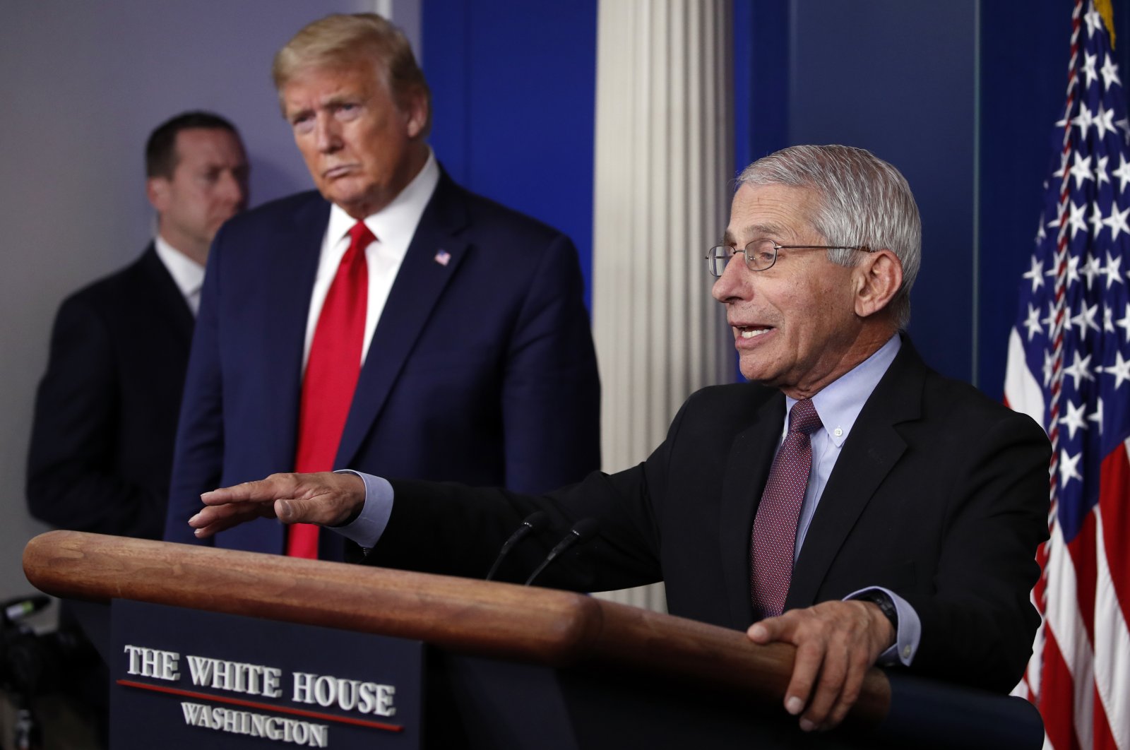 President Donald Trump listens as Dr. Anthony Fauci, director of the National Institute of Allergy and Infectious Diseases, speaks about the coronavirus in the James Brady Press Briefing Room of the White House in Washington, April 22, 2020. (AP Photo)