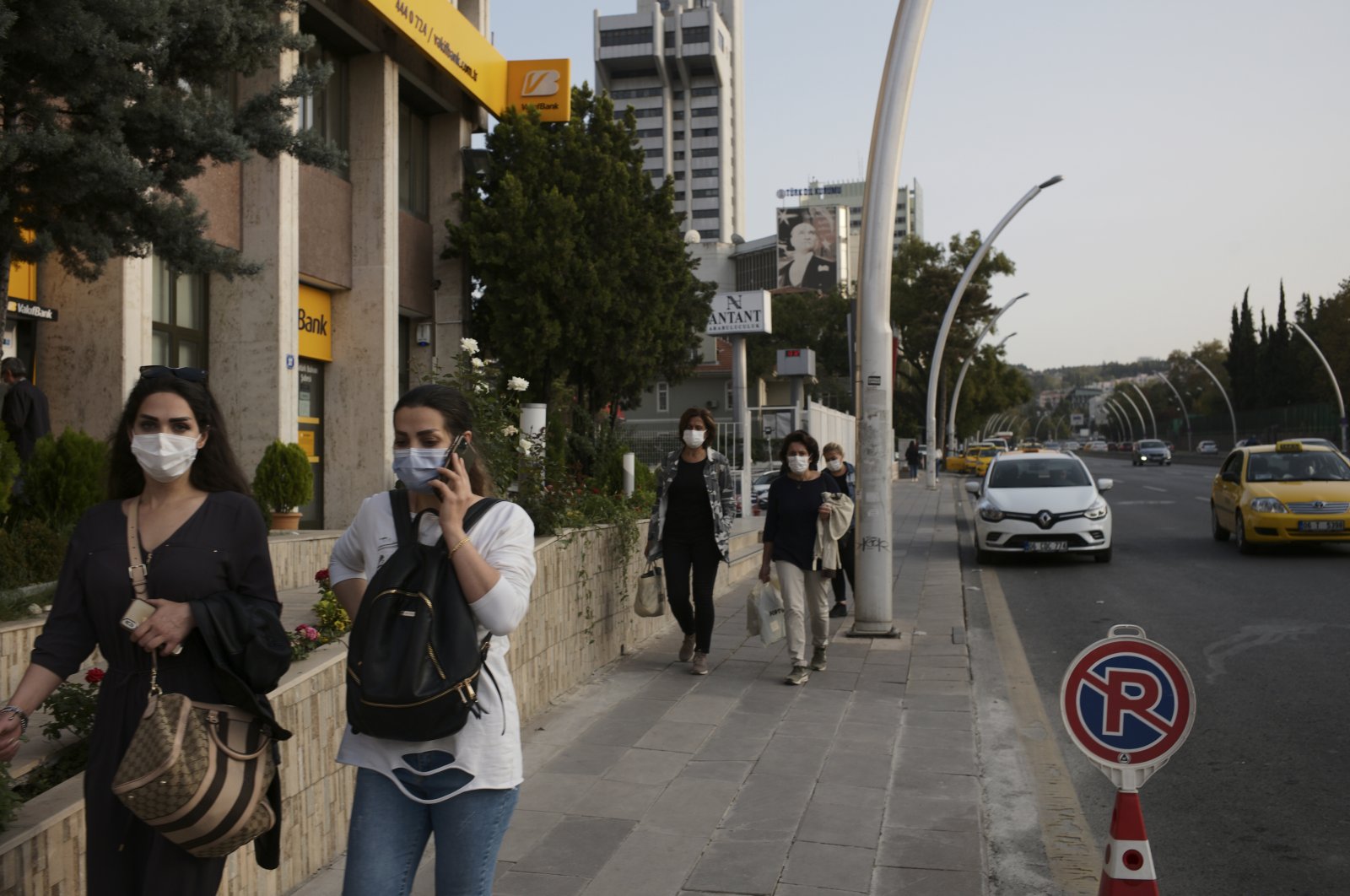 People wearing masks against the coronavirus, in the capital Ankara, Turkey, Oct. 27, 2020. (AP Photo)