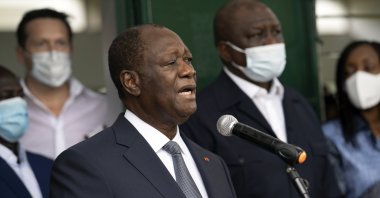 Ivory Coast President Alassane Ouattara speaks to journalists after voting at a polling station during presidential elections in Abidjan, Ivory Coast, Saturday, Oct. 31, 2020. (AP Photo)