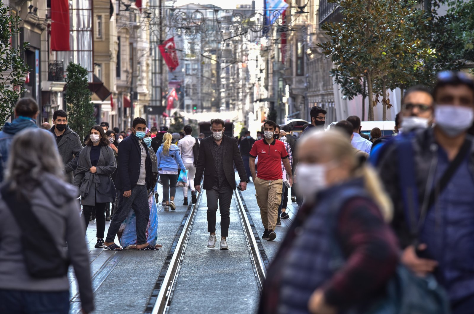 People wearing protective masks walk on Istiklal Avenue, in Istanbul, Turkey, Nov. 2, 2020. (DHA Photo) 