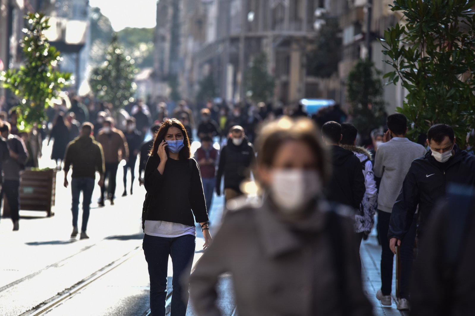 People with face masks walk on Istiklal street near Taksim Square, in Istanbul, Turkey, Nov. 2, 2020. (DHA Photo) 