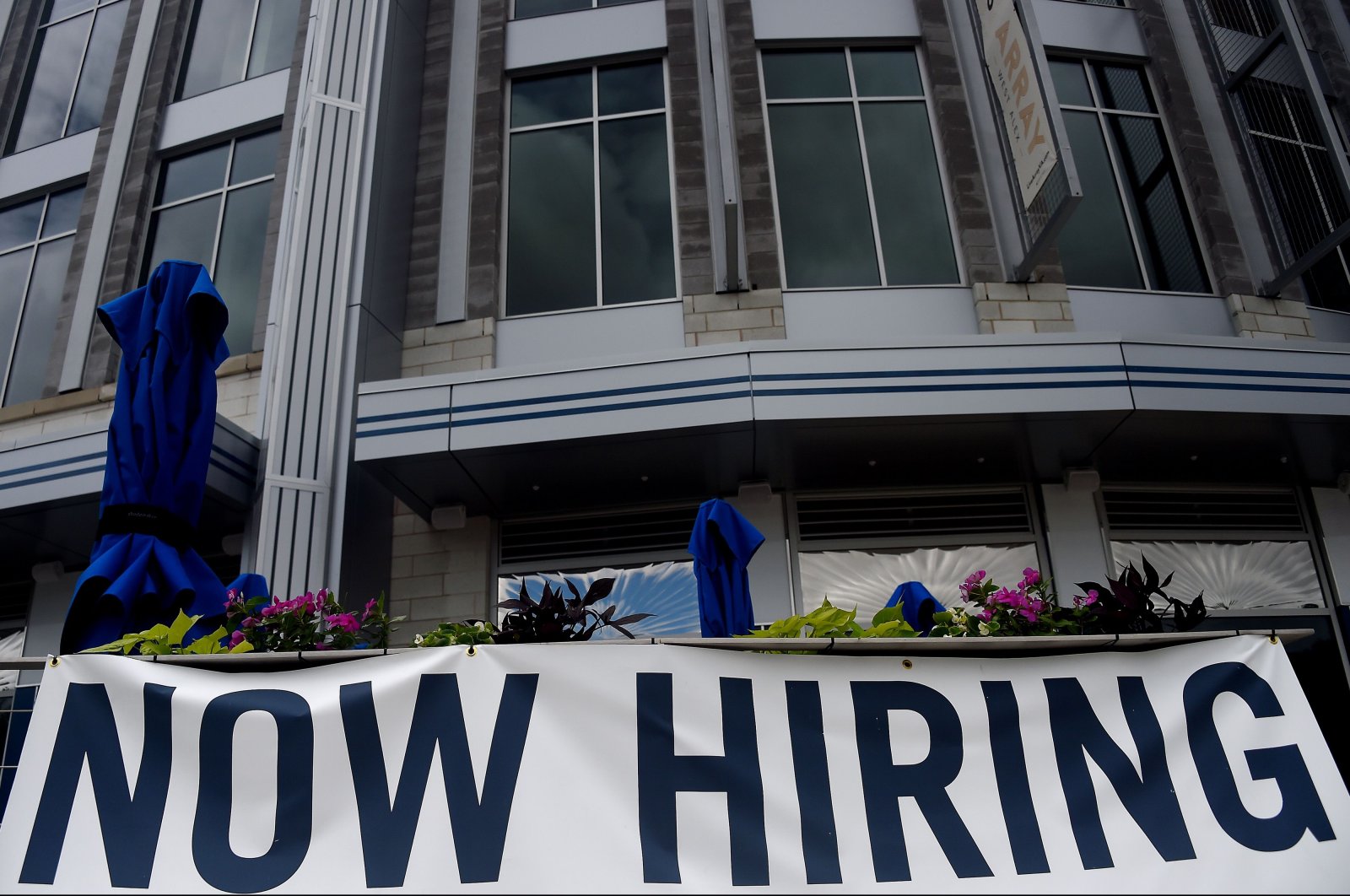 In this file photo taken on August 04, 2020 A restaurant displays a "Now Hiring" sign amid the coronavirus pandemic in Arlington, Virginia. (AFP Photo)