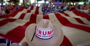 President Trump supporters wave a flag during an election watch party, Tuesday, Nov. 3, 2020, in Chandler, Ariz. (AP Photo)