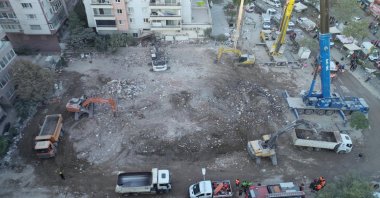 Bulldozers flatten the area where an apartment building collapsed in the earthquake once stood, in Izmir, Turkey, Nov. 4, 2020. (DHA Photo) 