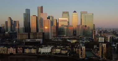 An aerial view of London's Canary Wharf financial district as the sun rises over the River Thames in London on Nov. 4, 2020. (AFP Photo)