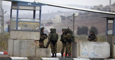 Israeli soldiers secure the area at the Huwara checkpoint south of the West Bank city of Nablus, Nov. 4, 2020. (AP Photo)