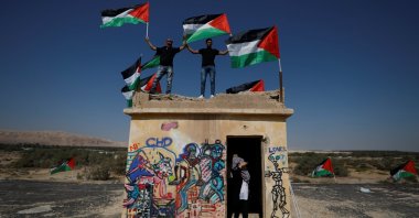 Demonstrators hold Palestinian flags during protests against Jewish settlements in the occupied West Bank, Sept. 28, 2019. (Reuters Photo)