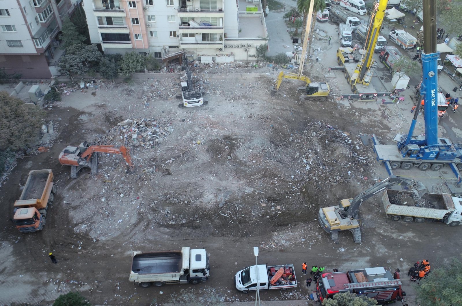Bulldozers flatten the area where an apartment building collapsed in the earthquake once stood, in Izmir, Turkey, Nov. 4, 2020. (DHA Photo) 