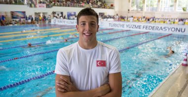 This undated photo shows Turkish national swimmer Emre Sakcı standing in front of a swimming pool in Istanbul, Turkey. (DHA Photo)