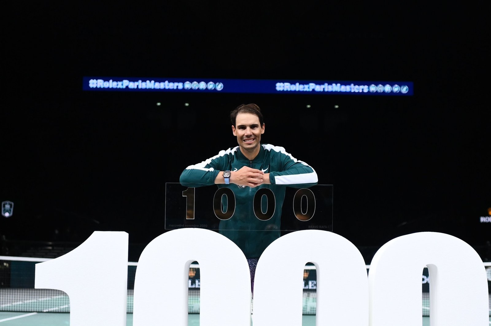 Rafael Nadal poses with the trophy for his 1,000th victory after the Paris Masters match against Feliciano Lopez, in Paris, France, Nov. 4, 2020. (AFP Photo)