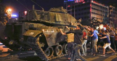 People try to stop a tank commanded by putschists during the coup attempt, in the capital Ankara, Turkey, July 16, 2016. (Reuters Photo)