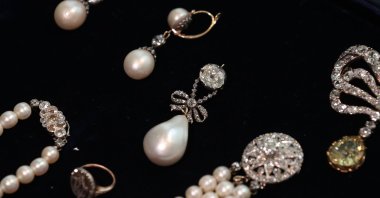 In this file photo, an assortment of jewelry including "Queen Marie Antoinette's Pearl" (C) is pictured at Sotheby's auction house in London, Britain, Oct. 19, 2018. (AFP Photo)