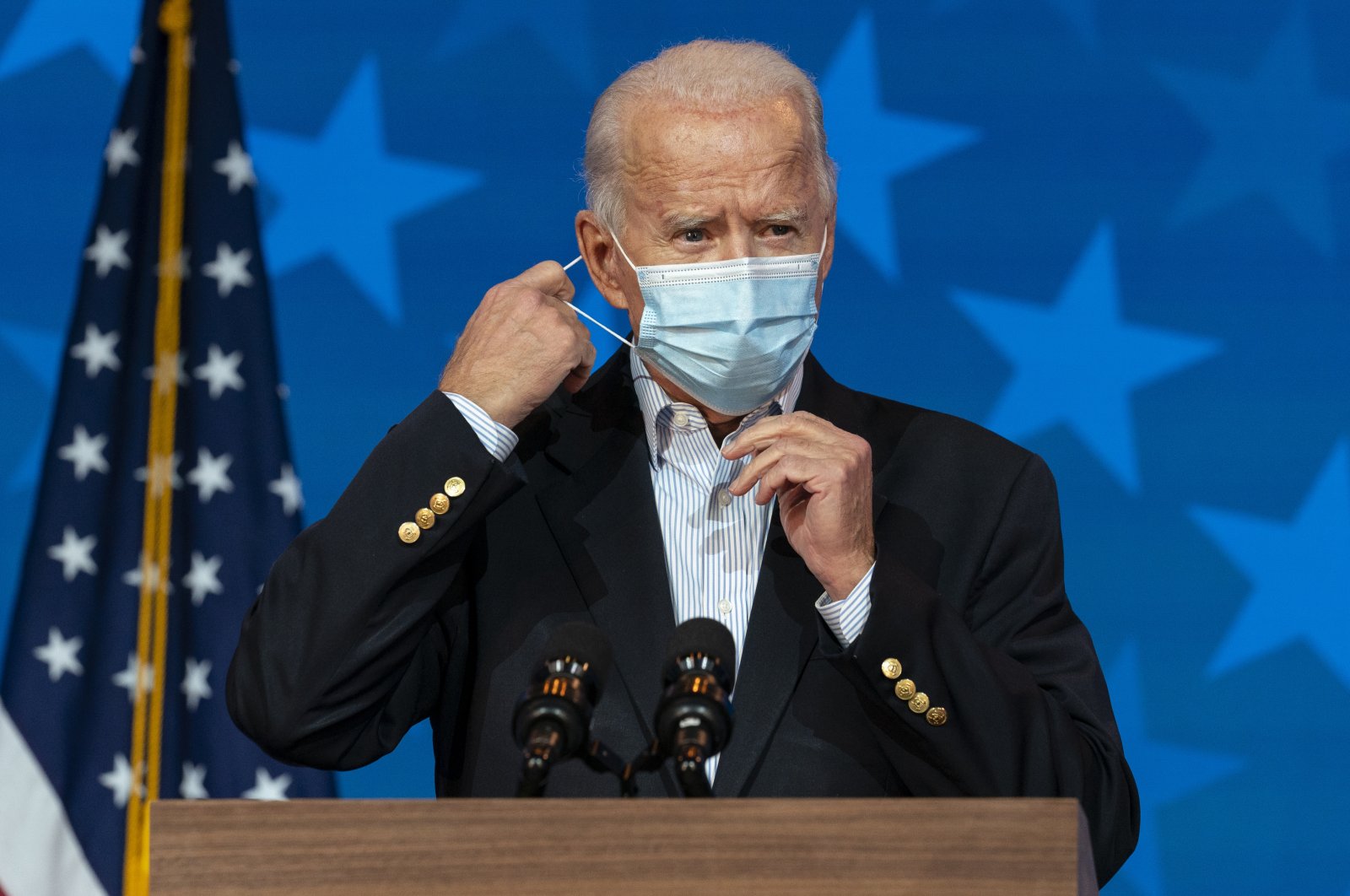 Democratic presidential candidate former Vice President Joe Biden removes his face mask to speak at The Queen theater, in Wilmington, Delaware, Nov. 5, 2020. (AP Photo)
