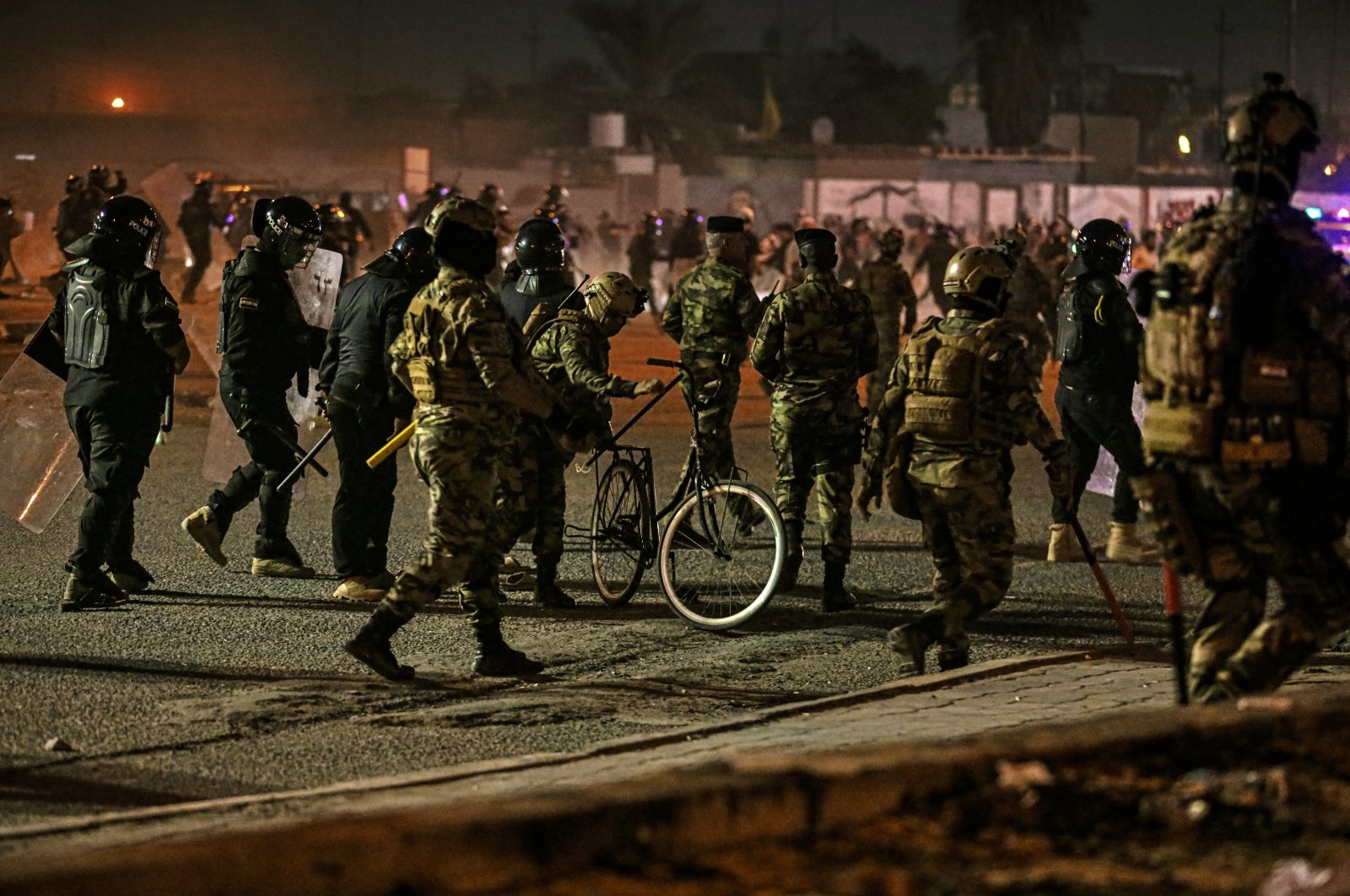 Security forces prevent anti-government protesters from setting up sit-in tents in Basra, Iraq, Nov. 6, 2020. (AP Photo)