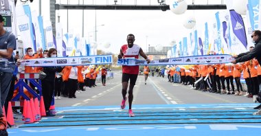 Benard Cheruiyot Sang, winner of the marathon in the men's category, arrives at the finish line, in Istanbul, Turkey, Nov. 8, 2020.  (İHA Photo)