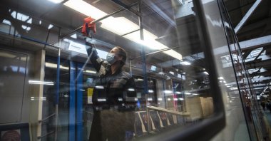 Moscow metro depot employee disinfects a metro train in Moscow, Russia, Thursday, Oct. 22, 2020. (AP Photo)
