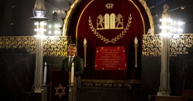 Rene de Reuver, speaking on behalf of the General Synod of the Protestant Church in the Netherlands, reads a statement at the Rav Aron Schuster Synagogue in Amsterdam, Netherlands, Nov. 8, 2020. (AP Photo)
