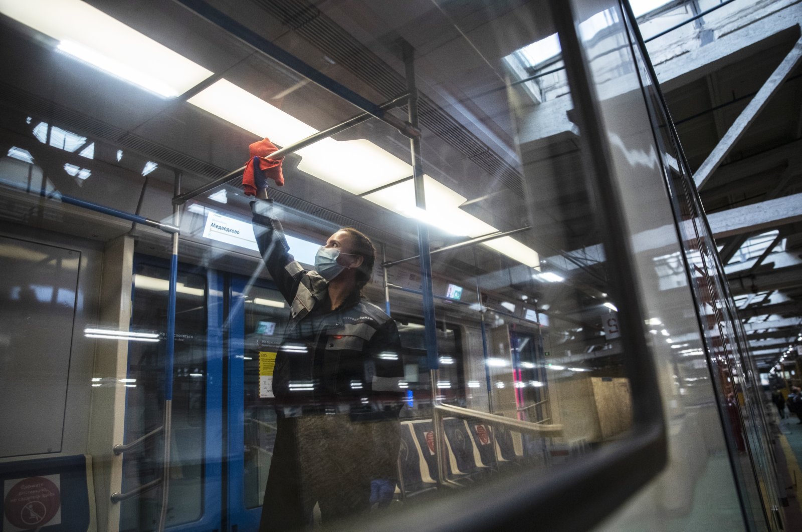 Moscow metro depot employee disinfects a metro train in Moscow, Russia, Thursday, Oct. 22, 2020. (AP Photo)