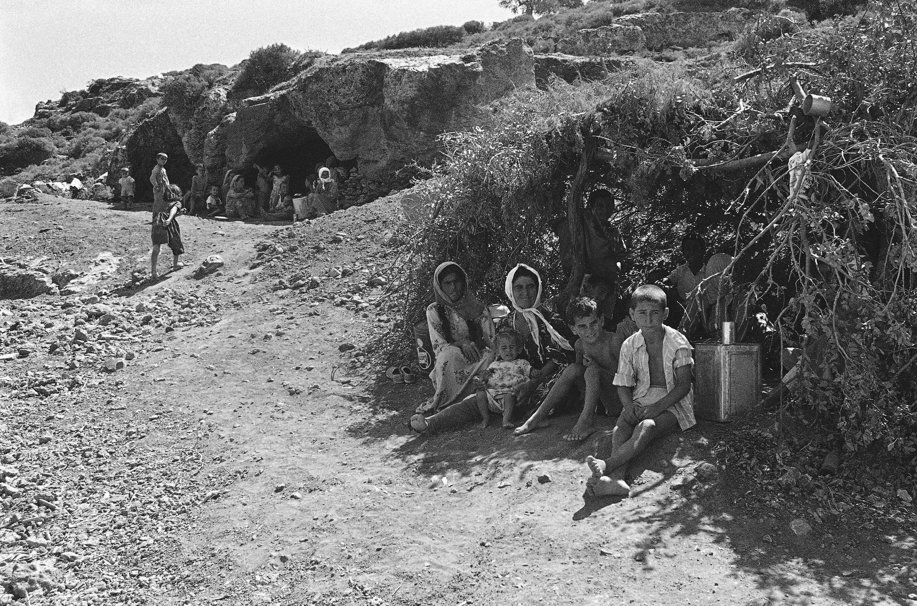 Turkish Cypriot refugees living in caves on a hill outside the village of Kokkina (Erenköy) on Sept. 12, 1964 in Nicosia. The village, housing thousands of refugees starting from 1963, was one of the few areas where arms and supplies could be brought in from Turkey and remained under Greek Cypriot siege for over a decade. (AP Photo)