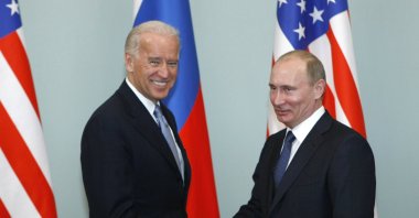 Former Vice President of the United States Joe Biden, left, shakes hands with Russian then- Prime Minister Vladimir Putin in Moscow, Russia, March 10, 2011. (AP Photo)