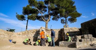 Archaeologists stand at the Roman-era tomb unearthed in Diyarbakır province, southeastern Turkey, Nov. 9, 2020. (AA Photo)