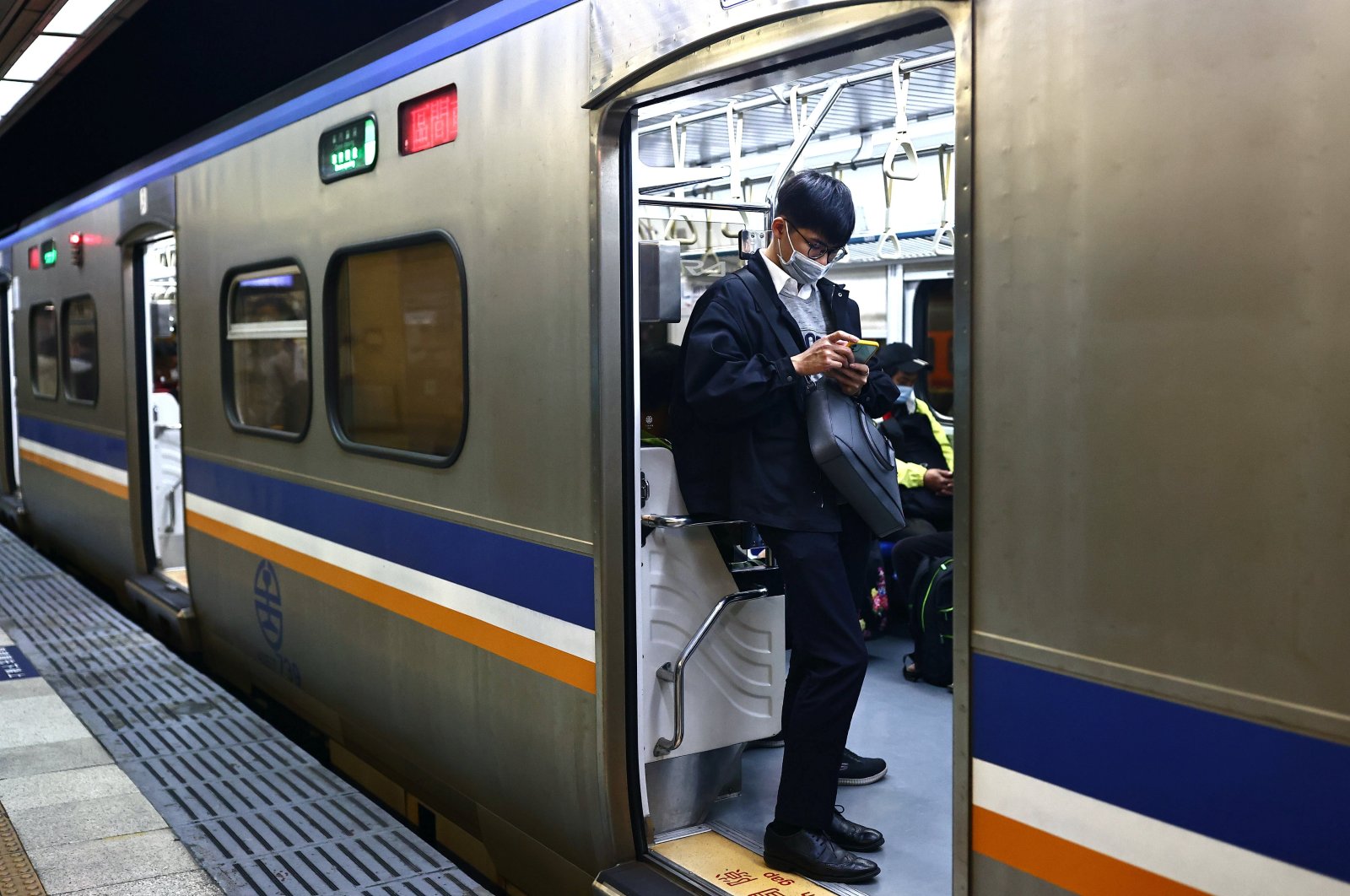 A man wears a protective mask to prevent the spread of the coronavirus disease (COVID-19) while taking the train in Taipei, Taiwan, Nov. 3, 2020. (Reuters Photo)