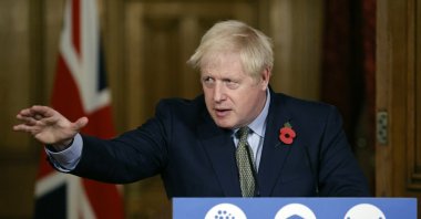 British Prime Minister Boris Johnson reaches out during a virtual press conference at 10 Downing Street, London, Nov. 9, 2020. (AP Photo)