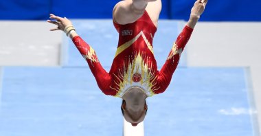 Zhou Ruiyu of China competes on the balance beam during the Friendship and Solidarity Competition gymnastics event, in Tokyo, Japan, Nov. 8, 2020. (AFP Photo)
