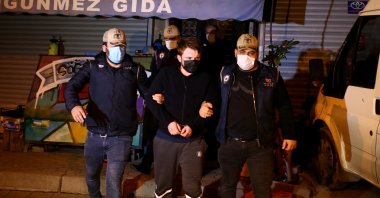 Police escort a detained suspect captured during an operation in Istanbul, Turkey, Nov. 10, 2020. (AA Photo) 