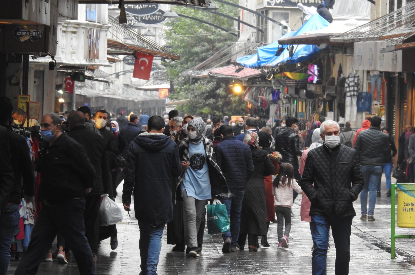 People wearing protective masks walk on a street in Gaziantep, southeastern Turkey, Nov. 5, 2020. (IHA Photo)