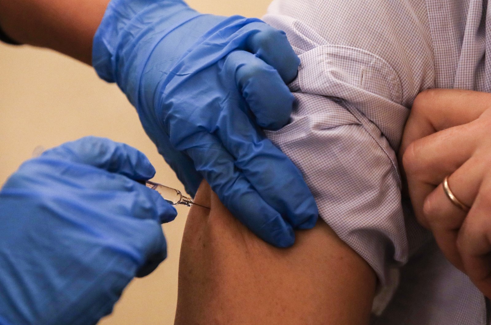 A nurse injects a flu vaccine at the museum of science and technology in Milan, Italy, Nov. 4, 2020. (AP Photo)
