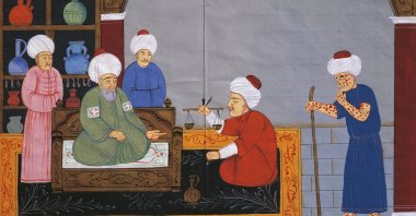 Preparation of medicines for the treatment of a patient suffering from smallpox, miniature from "The Canon of medicine," by Avicenna (980-1037), Ottoman manuscript in 17th century Istanbul. (Istanbul University Library/Photo by DeAgostini/Getty Images)