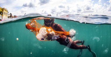 World record holder Turkish free diver Şahika Encümen dives into the Marmara Sea to promote the Zero Waste project, Istanbul, Turkey, July 1, 2020. (AA Photo)
