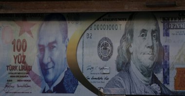 Posters of the U.S. dollar and Turkish lira are seen on a currency exchange shop in the city of Azaz, Syria, Aug. 18, 2018. (Reuters Photo)