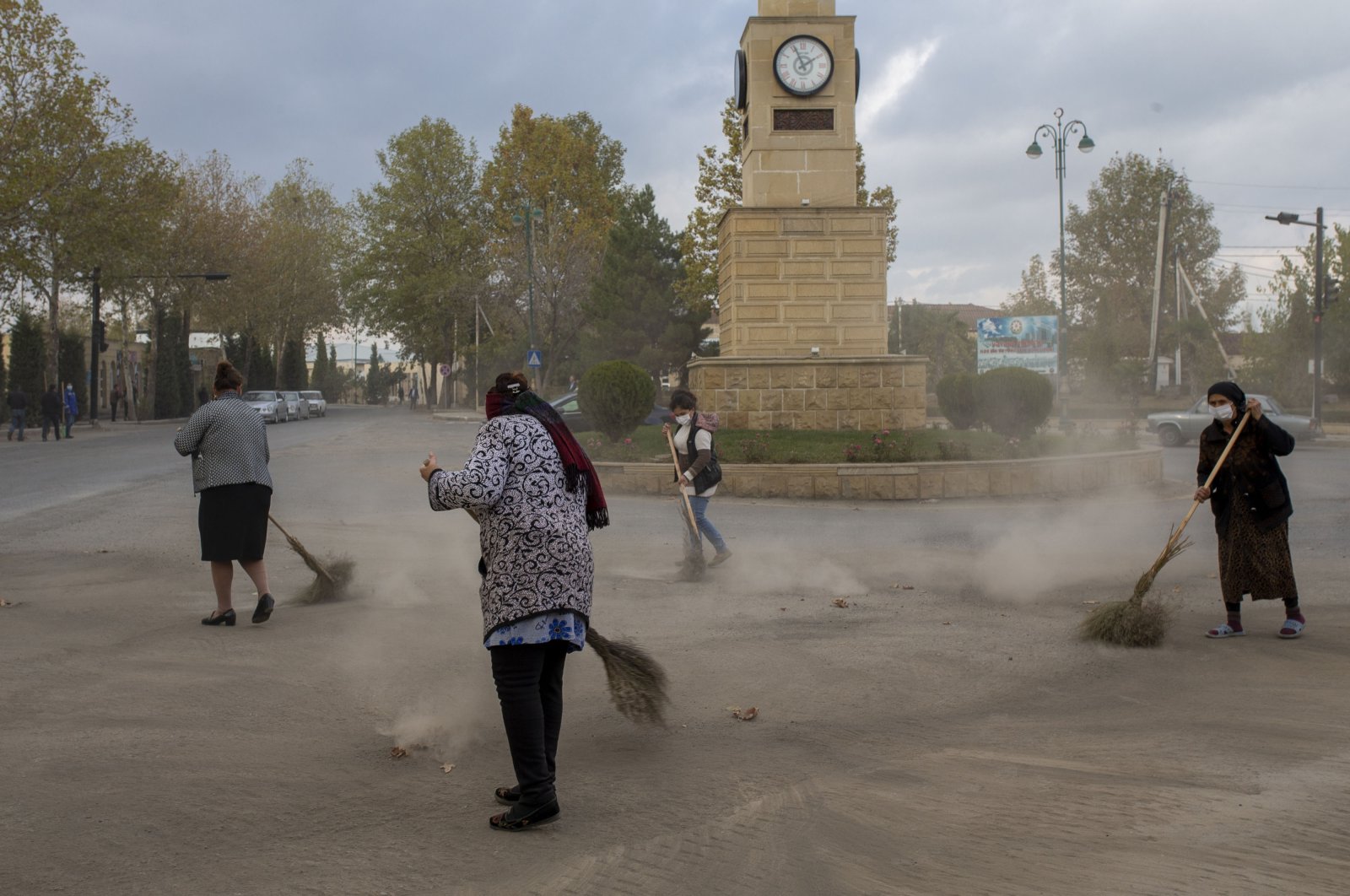 Local residents clean the streets in the Azerbaijani city of Tartar, Nov. 11, 2020. (AA Photo)
