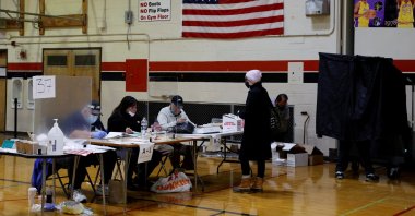 A voter and election workers wear protective masks on Election Day in South Philadelphia High School, in Philadelphia, Pennsylvania, U.S., Nov. 3, 2020. (Reuters Photo)
