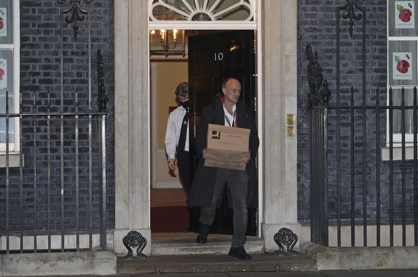 Britain's Prime Minister Boris Johnson's top aide Dominic Cummings leaves 10 Downing Street with a box, in London, Friday, Nov. 13, 2020. (AP Photo)