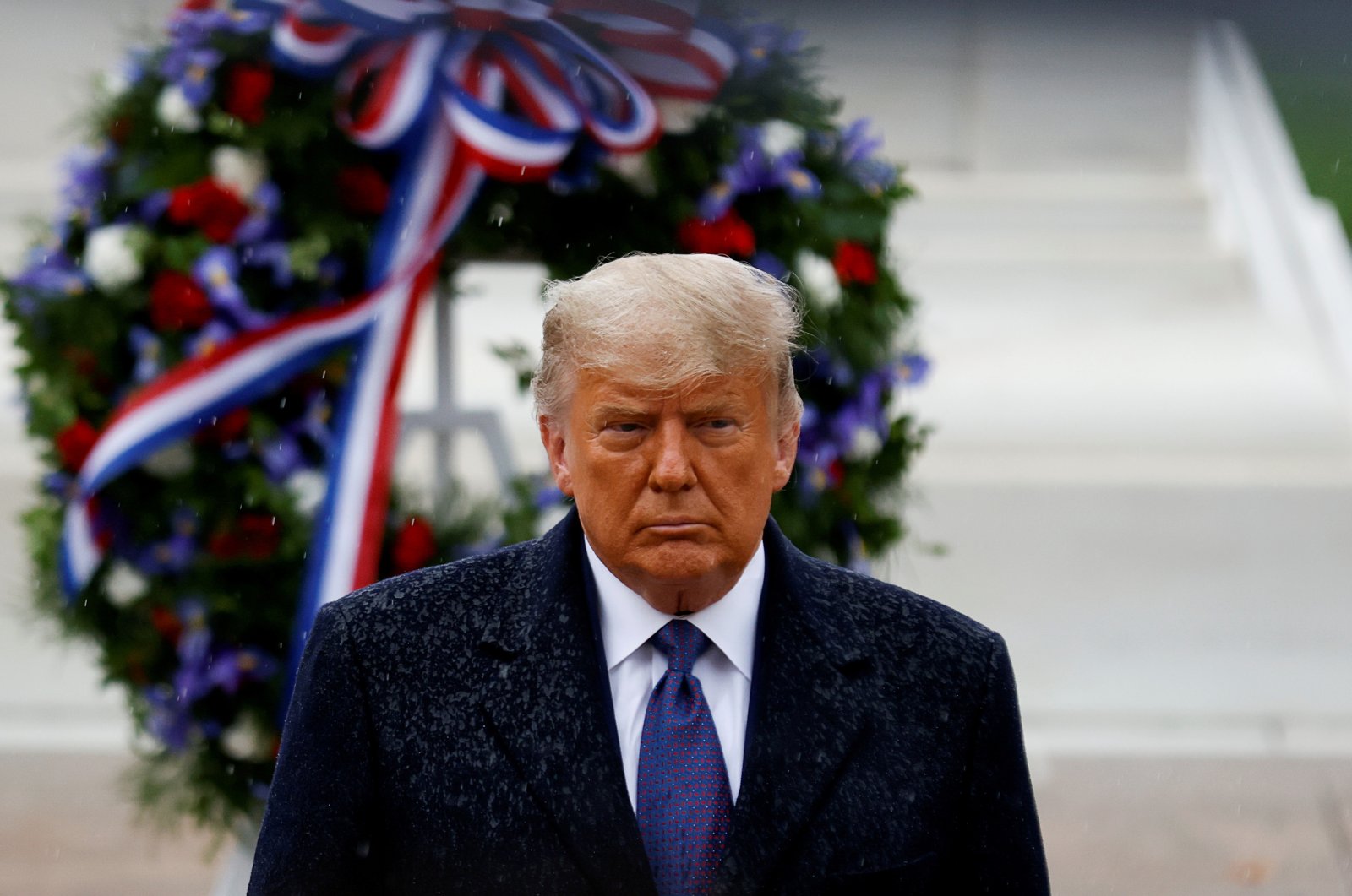 U.S. President Donald Trump turns after placing a wreath at the Tomb of the Unknown Soldier as he attends a Veterans Day observance in the rain at Arlington National Cemetery in Arlington, Virginia, U.S., Nov. 11, 2020. (Reuters Photo)