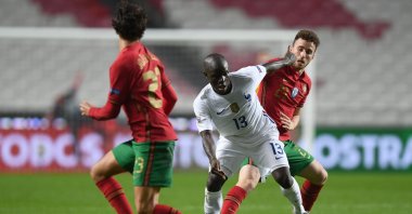 France's N'Golo Kante (C) vies with Portugal's Diogo Jota (R) during a UEFA Nations League match in Lisbon, Portugal, Nov. 14, 2020. (AFP Photo)