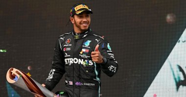 Mercedes driver Lewis Hamilton celebrates with his trophy after winning the Formula One Turkish Grand Prix in Istanbul, Turkey, Nov. 15, 2020. (AFP Photo)