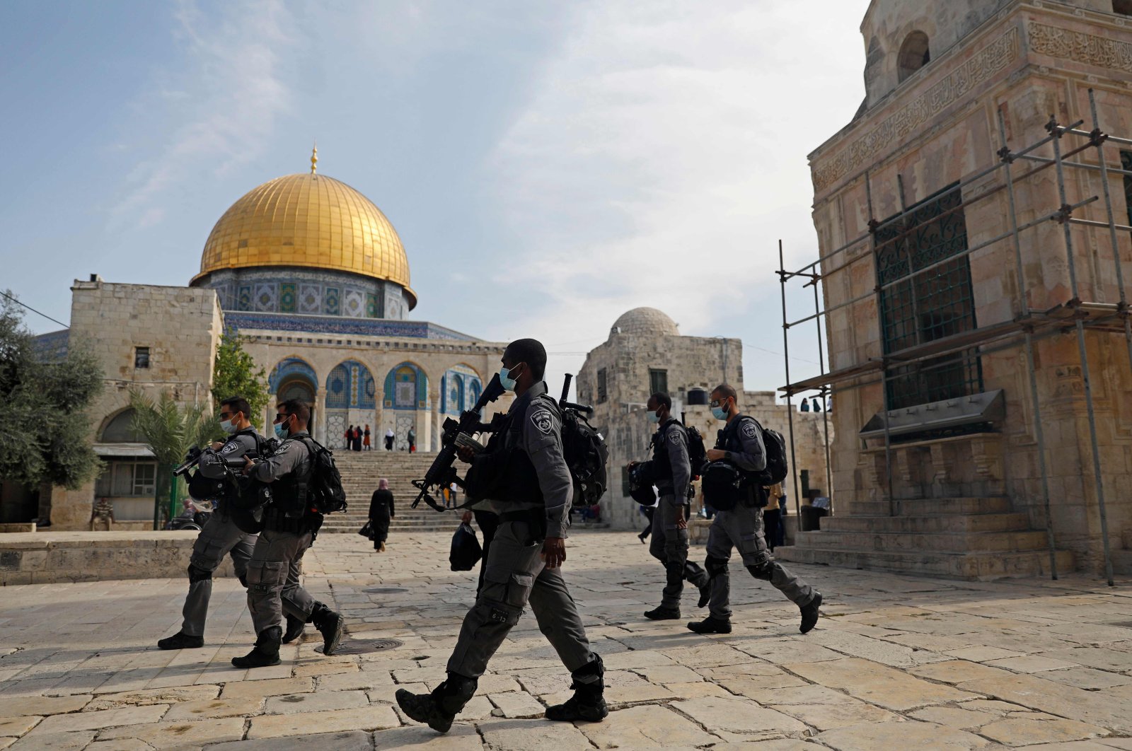 Israeli forces patrol the Al-Aqsa mosque compound, Islam's third holiest site, in the Old City of Jerusalem, as Palestinians stage protest (unseen) against comments by French President Emmanuel Macron defending cartoons of the Prophet Muhammed, Oct. 30, 2020. (AFP Photo)