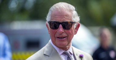 Britain's Prince Charles speaks to emergency workers during a visit to Middlemoor Fire Station, where he met Emergency Service Personnel from the local Fire Department, Police and Ambulance services, in Devon, England, July 22, 2020. (Pool photo via AP)