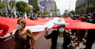 Demonstrators carry a national flag as Peru's Congress elected legislator Francisco Sagasti as the country's interim president, in Lima, Peru, Nov. 16, 2020. (Reuters Photo)