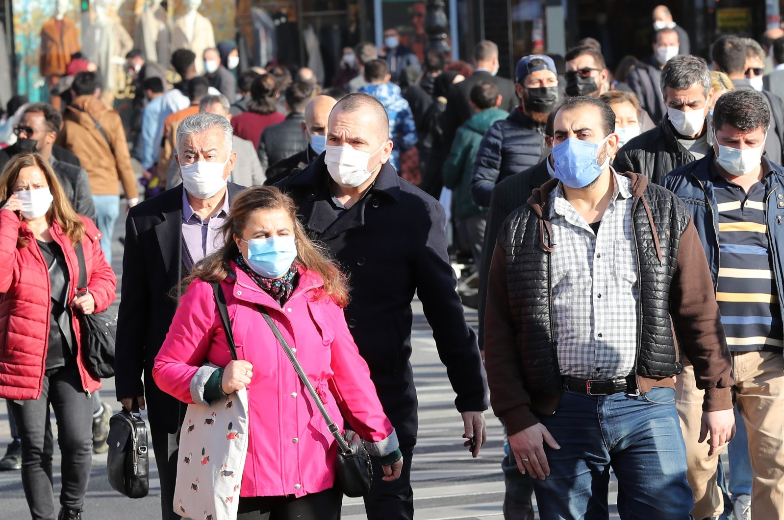 Pedestrians wearing face masks walk in the capital Ankara, Turkey, Nov. 13, 2020. (AFP Photo)