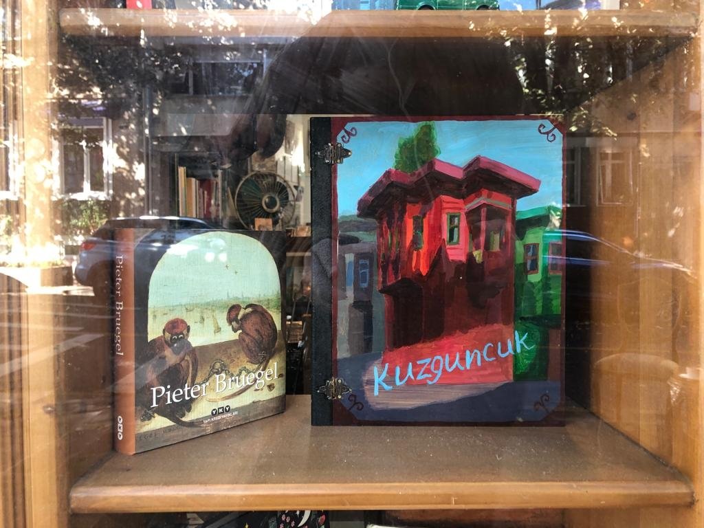 Coffee-table books on the 16th-century artist Pieter Bruegel and covers depicting the charm of Kuzguncuk can be seen through the front window. (Photo by Matt Hanson)