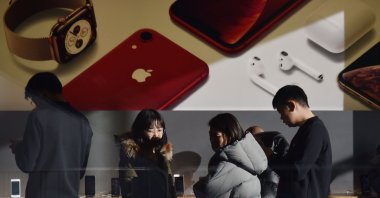 Customers look at products in an Apple store in Beijing, China, Dec. 11, 2018. (AFP Photo)