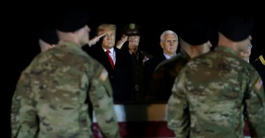 U.S. President Donald Trump salutes the transfer cases holding the remains of U.S. Army soldier Sergeant Javier Jaguar Gutierrez, who was killed in the Nangarhar province in eastern Afghanistan, during a dignified transfer at Dover Air Force Base, in Dover, Delaware, U.S. Feb. 10, 2020. (REUTERS Photo)
