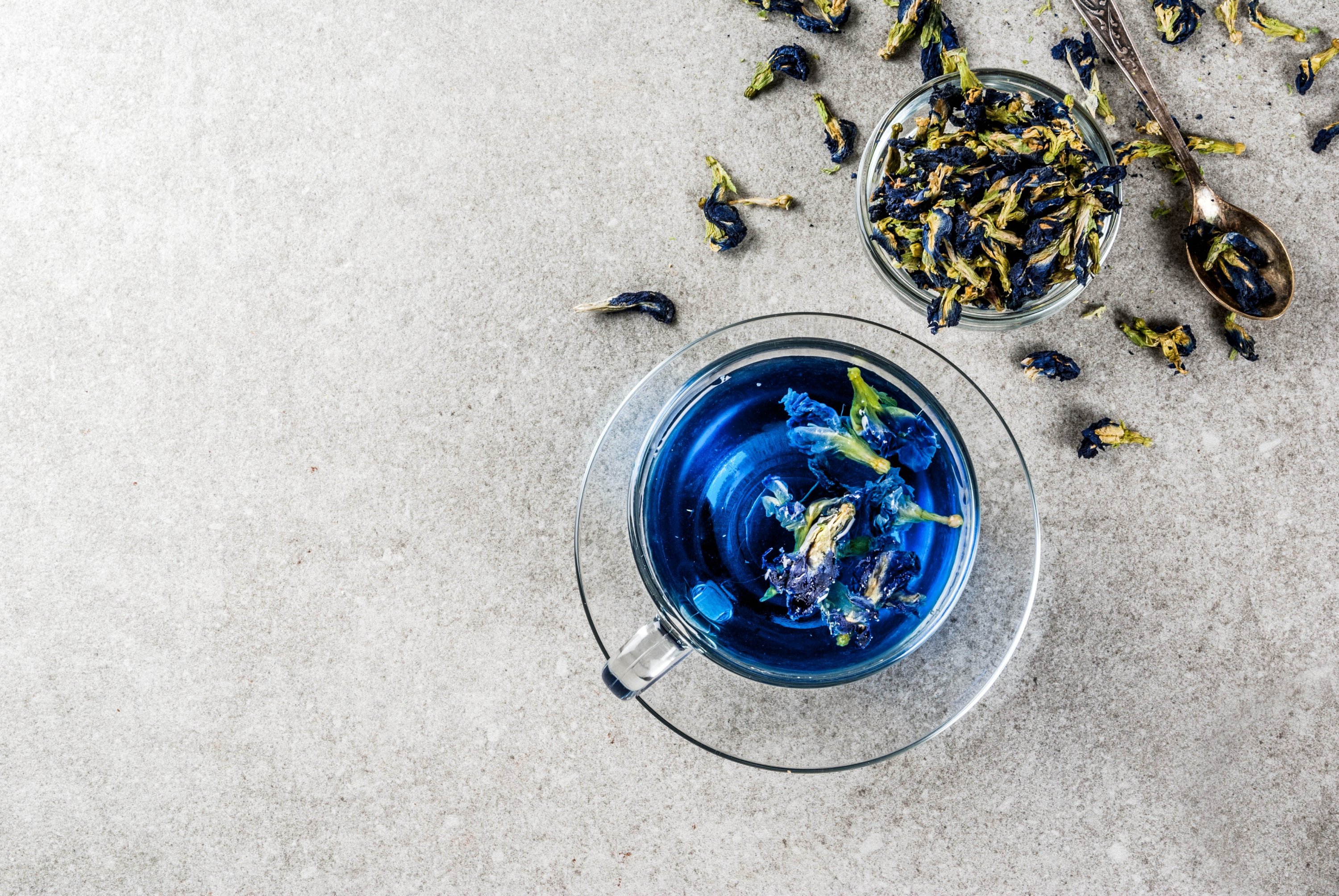 With just a few drops of lemon, butterfly pea flower tea turns a shade of purple. (Shutterstock Photo)