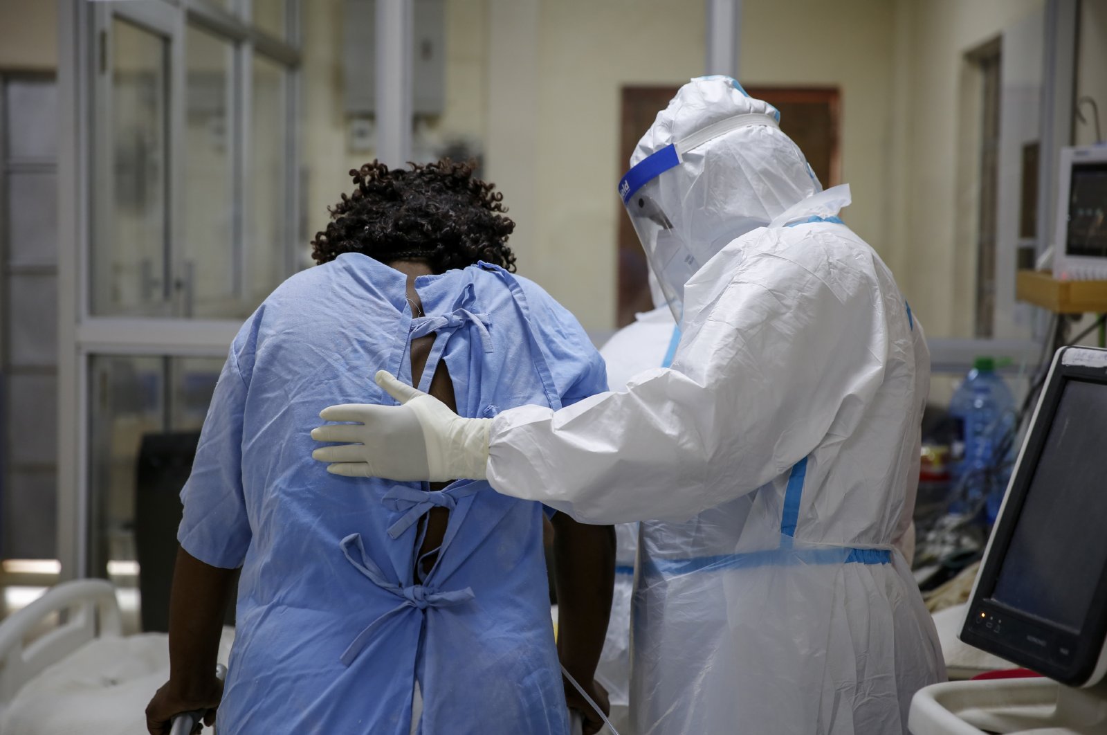 A medical worker attends to a coronavirus patient in the intensive care unit of an isolation and treatment center for those with COVID-19 in Machakos, south of the capital Nairobi, in Kenya, Nov. 3, 2020. (AP Photo)