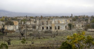 A view of a vast expanse of jagged concrete and houses are seen in Aghdam, once a lively town of nearly 40.000 inhabitants, in Azerbaijan, Nov. 19, 2020. (AP Photo)